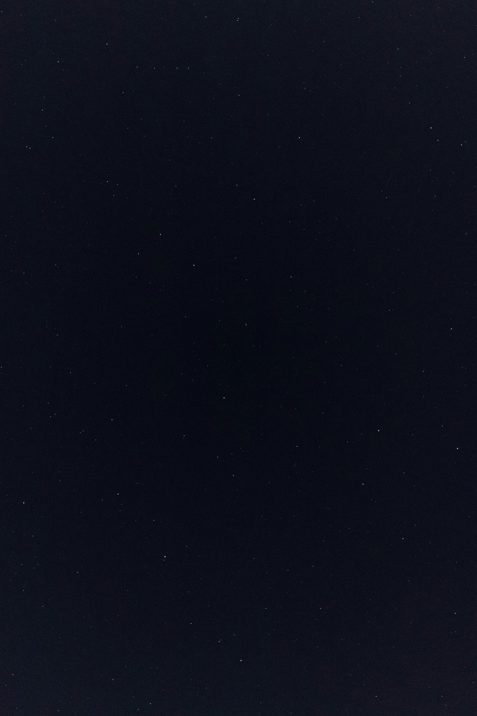 a night sky with a few stars in it